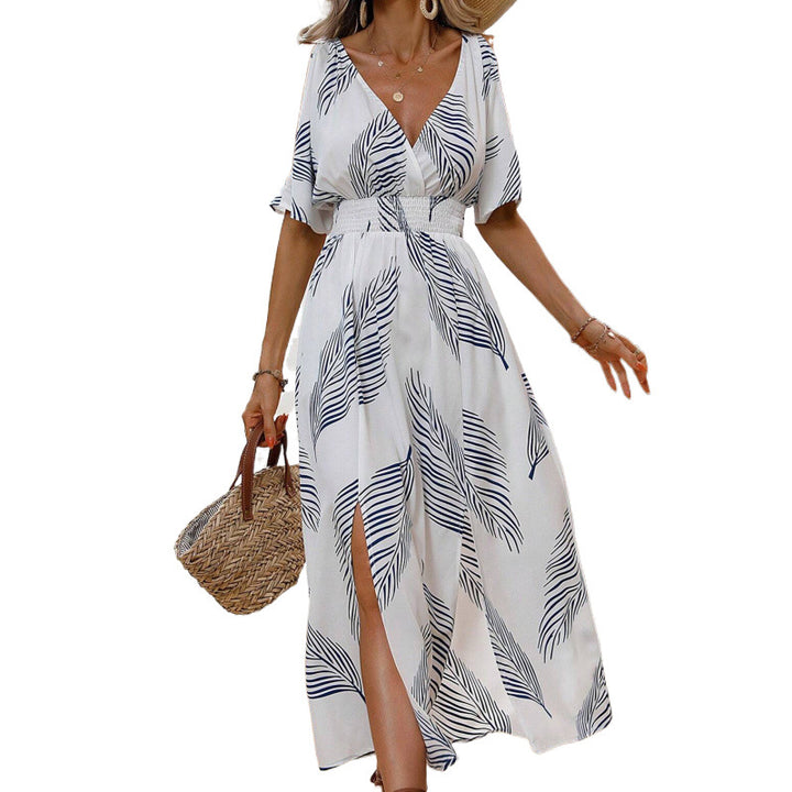 Dame maxikjole med elegant cut-out-design og flydende kant Stilla