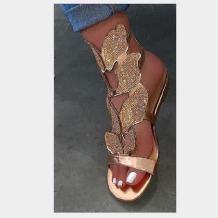 Dame Glitrende Sandaler med blomsterdesign og elegant rem Stilla