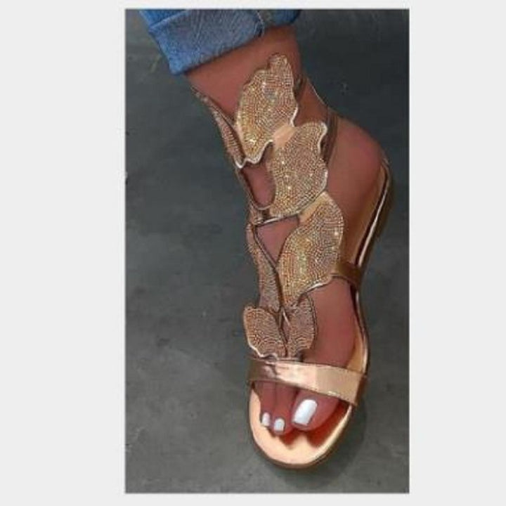 Dame Glitrende Sandaler med blomsterdesign og elegant rem Stilla