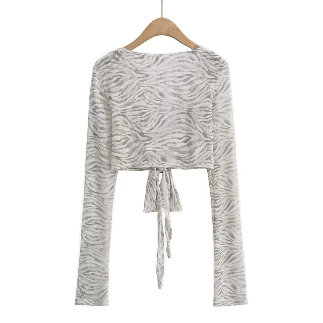 Dame cropped langærmet top med raffineret knude-design og elastisk stof Stilla