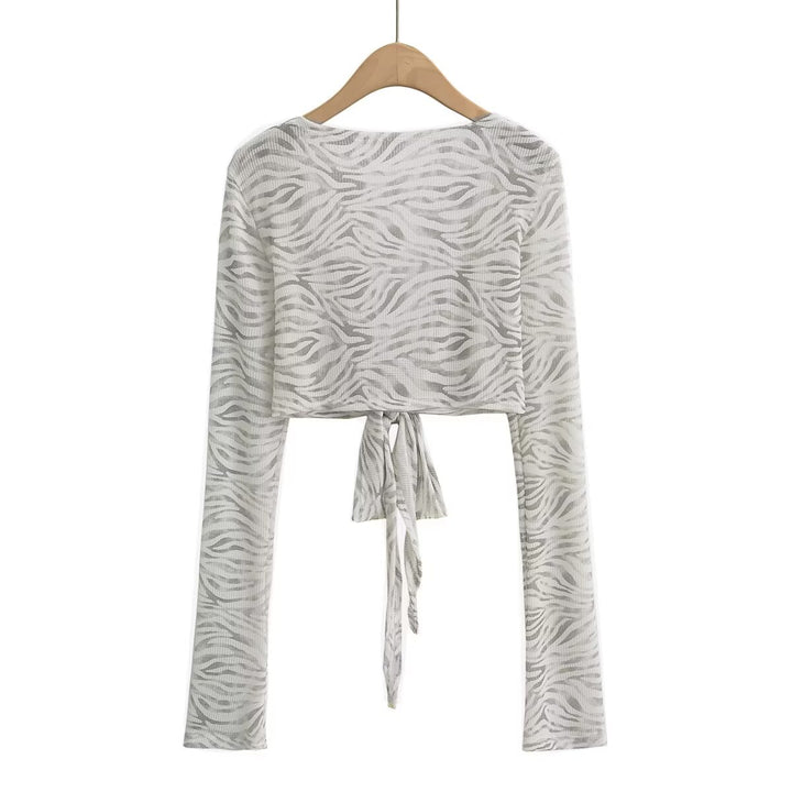 Dame cropped langærmet top med raffineret knude-design og elastisk stof Stilla
