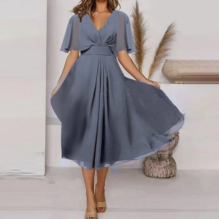 Dame Svingende Elegant Maxikjole med feminine Flæseærmer og Wrap-look Stilla