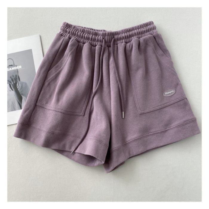 Kvindernes afslappede joggingshorts med elastisk talje og praktiske sidelommer