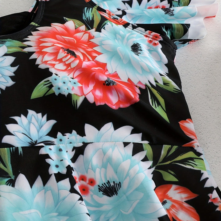 Dame én-delt badedragt med ruffledetails og blomstret design Skovae