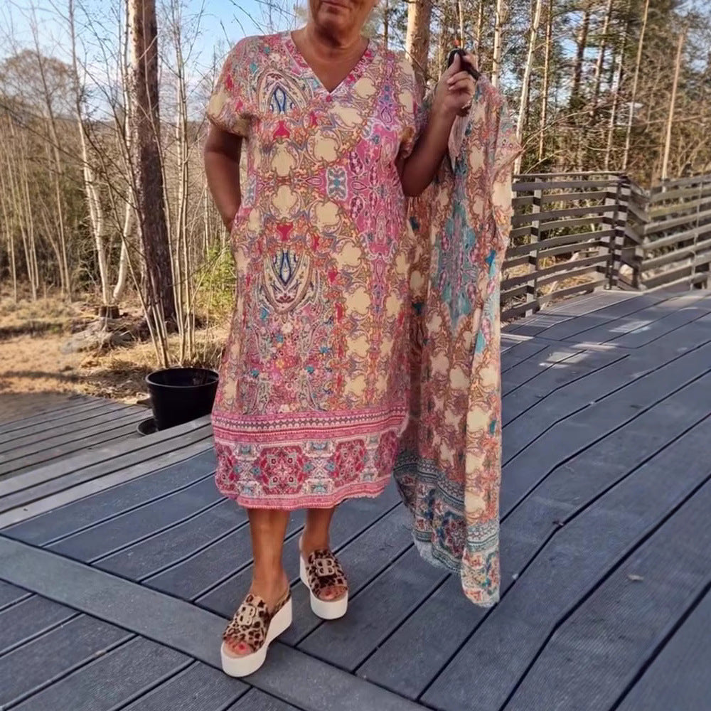 Dame nan flydende midikjole i tunika-kaftan-mix med V-udskæring, korte ærmer, løstsiddende pasform og matchende pareo Skovae