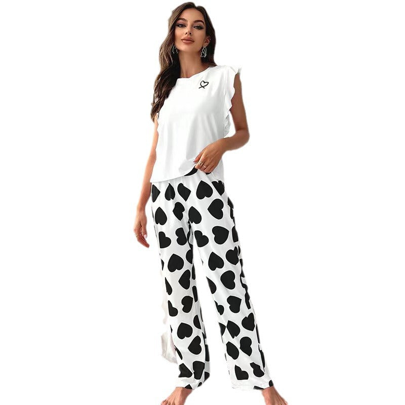Dame pyjamasæt med legende hjerte-design og flæse detaljer Stilla