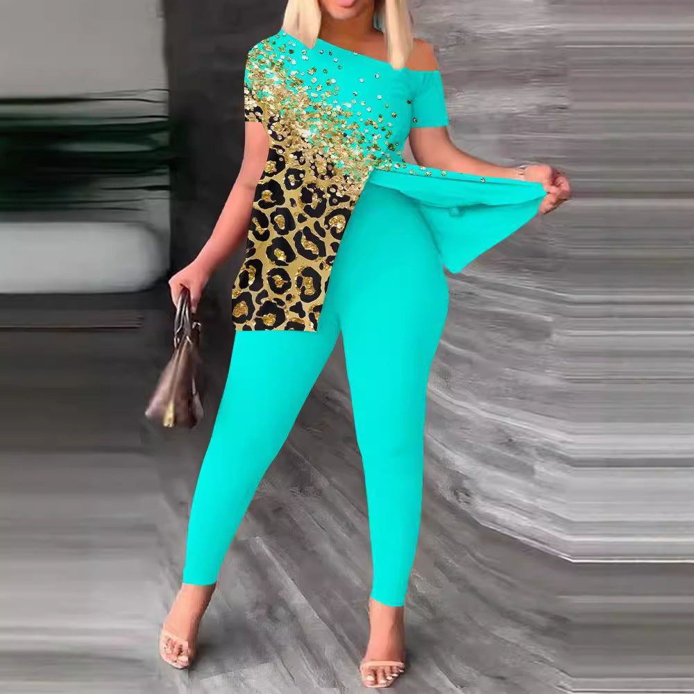 Dame figursyet jumpsuit med off-shoulder design og glamourøse accenter Skovae