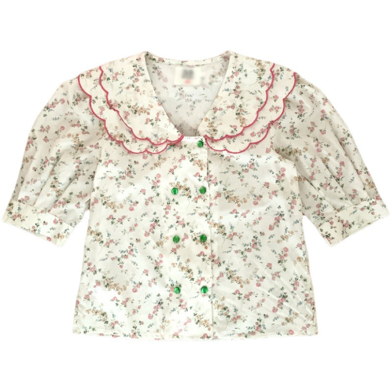 Damebluse med voluminøse puffærmer og blomsteretternet krave Stilla