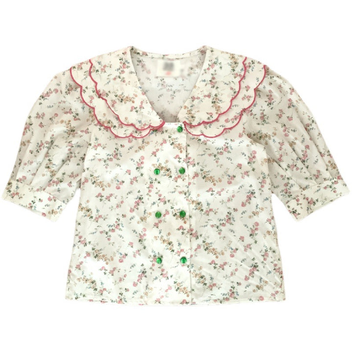 Damebluse med voluminøse puffærmer og blomsteretternet krave Stilla