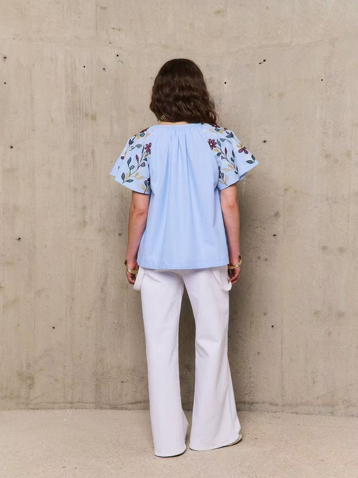 Dame tunika med kunstnerisk blomsterbroderi design Stilla
