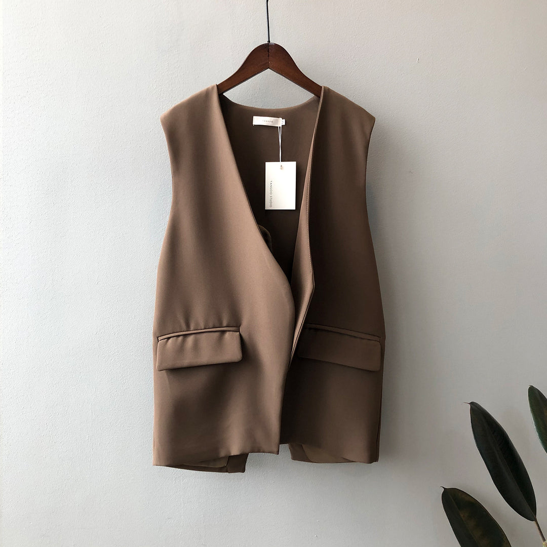 Dame elegant vest med dyb V-udskæring og praktiske lommer Stilla