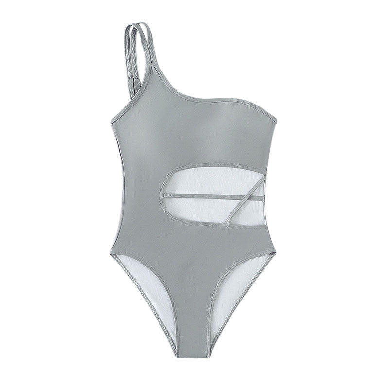 Dame en-delt badedragt med asymmetrisk snit og trendy cut-outs Skovae