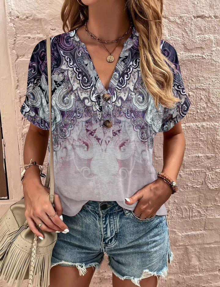 Damebluse med blomsterdesign og knaplukning Stilla