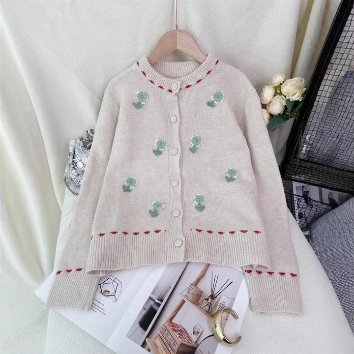 Dame cardigan med blomstret broderi design og knaplukning Stilla