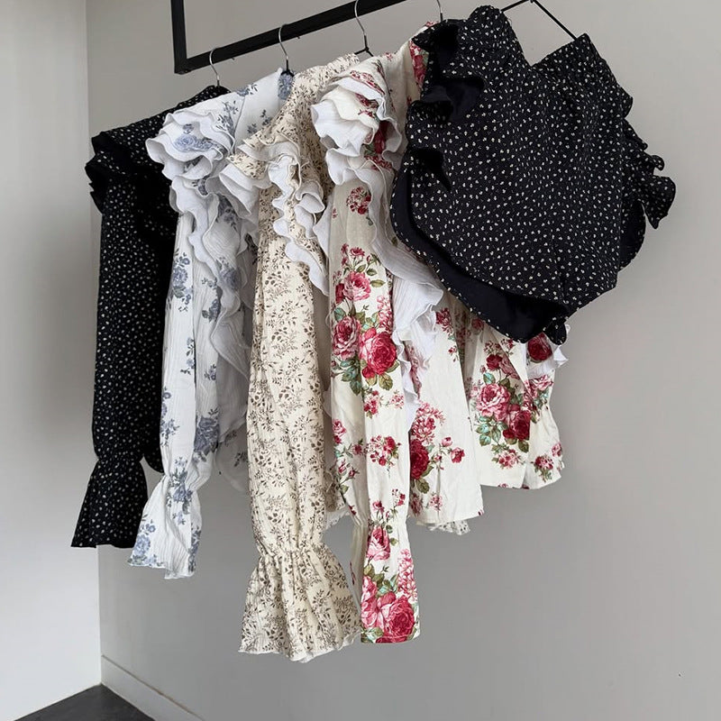 Dame playsuit med voluminøse flæseærmer og elegant bindebælte Stilla