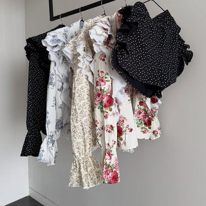 Dame playsuit med voluminøse flæseærmer og elegant bindebælte Stilla