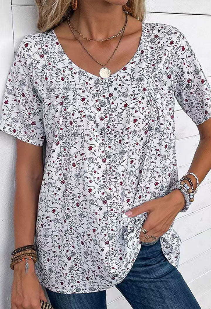 Dame nan afslappet kortærmet tunika-shirt med rund halsudskæring, delikat blomsterprint og dekorative brystfolder Skovae