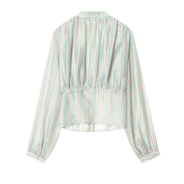 Damebluse med dyb V-udskæring og elegante ruffles detaljer Skovae