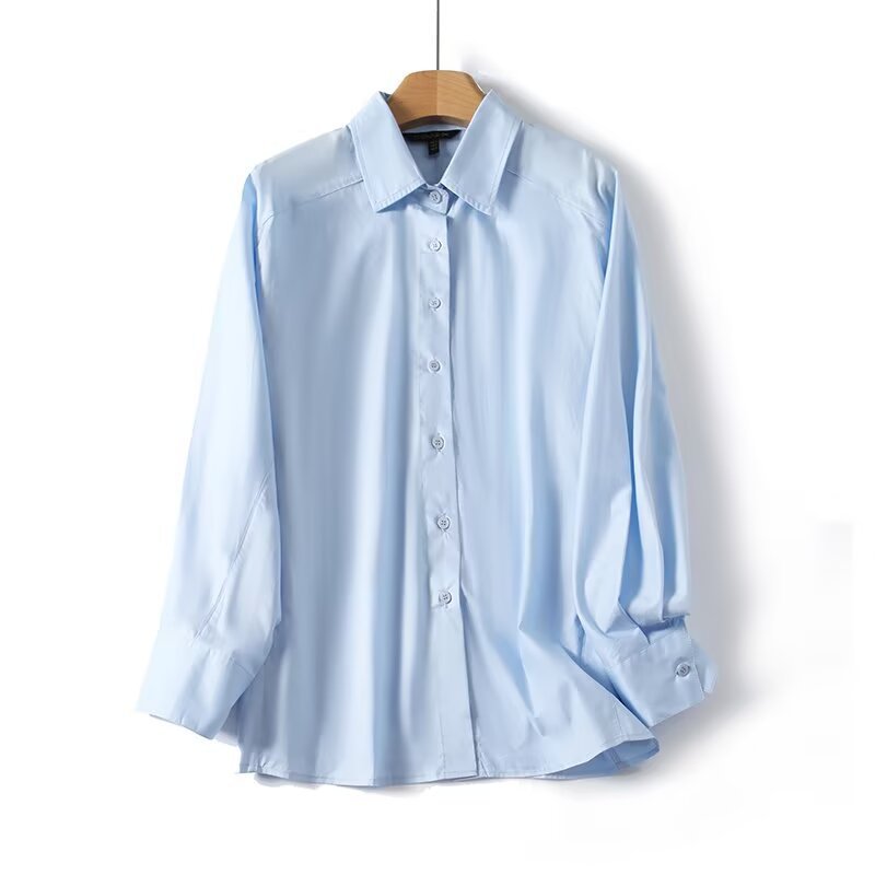 Dame elegant langærmet bluse med moderne detaljer og struktureret stof Skovae