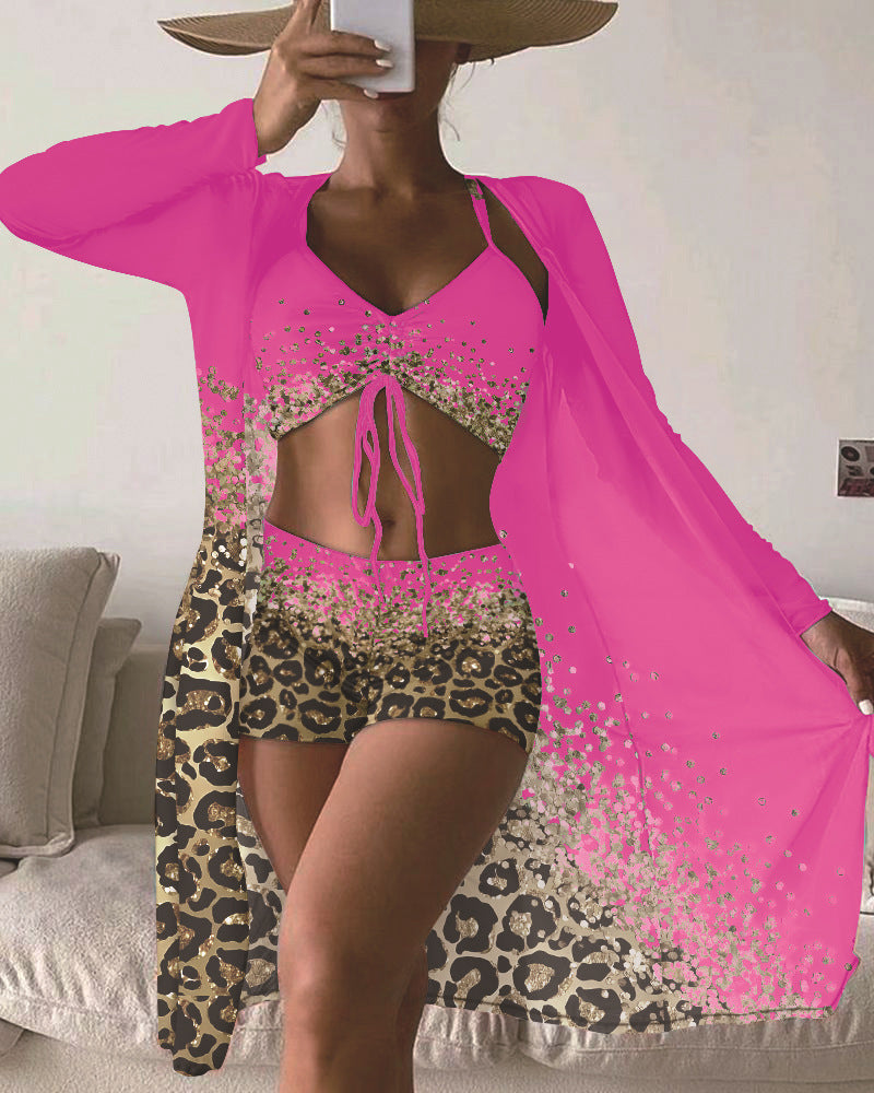 Dame strandoutfit med dyremønster og elegante accenter Stilla