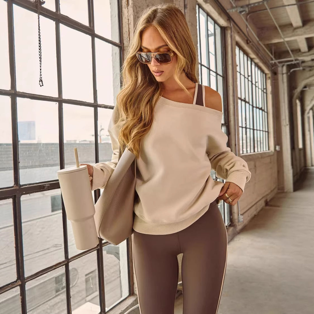 Kvinders afslappede off-shoulder sweater med brede ærmer og fashionable accenter Skovae