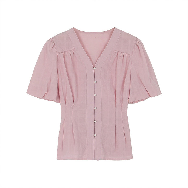 Damebluse med V-udskæring og puffærmer Stilla