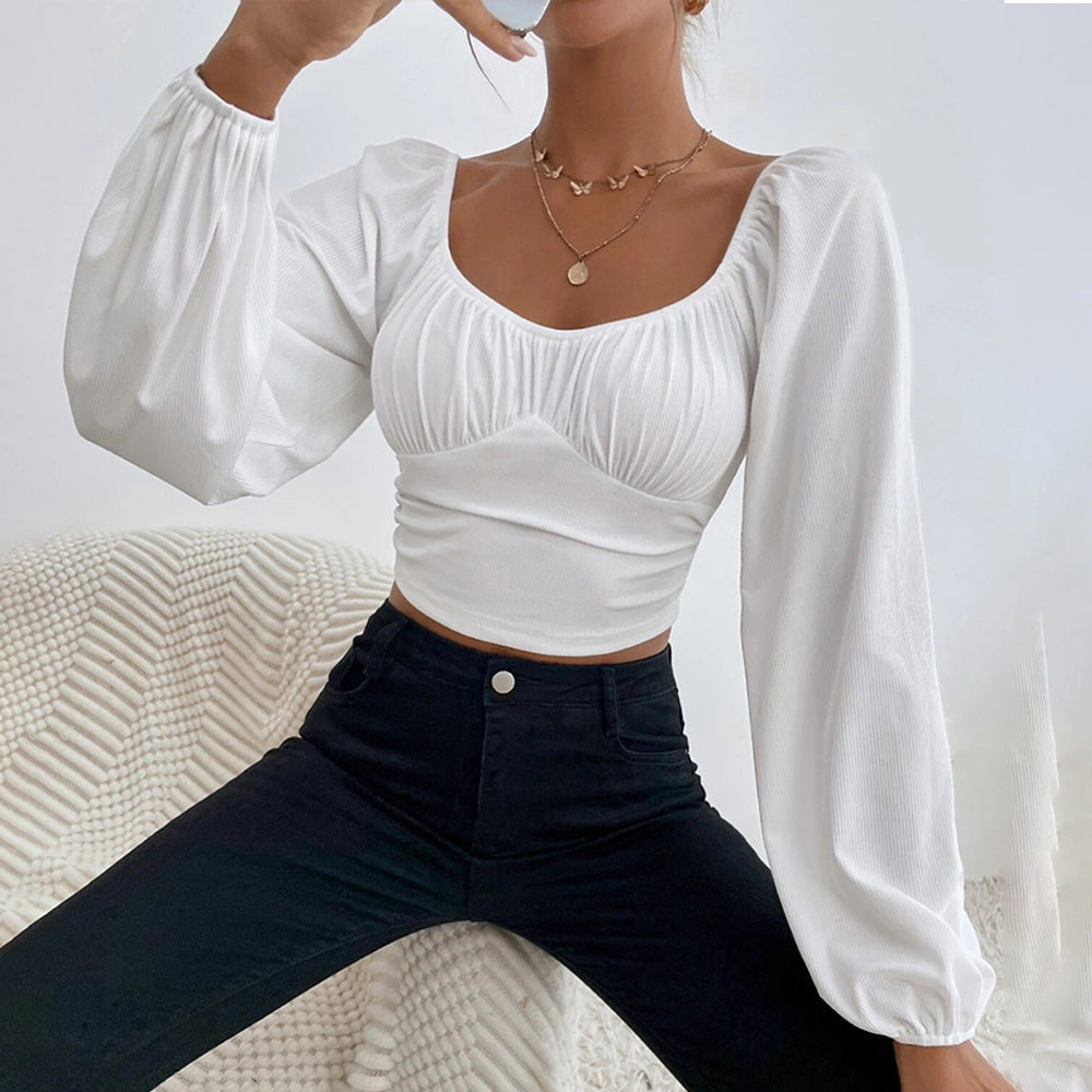 Kvindernes cropped top med stilfuldt pufærme-design og tætsiddende silhuet Stilla