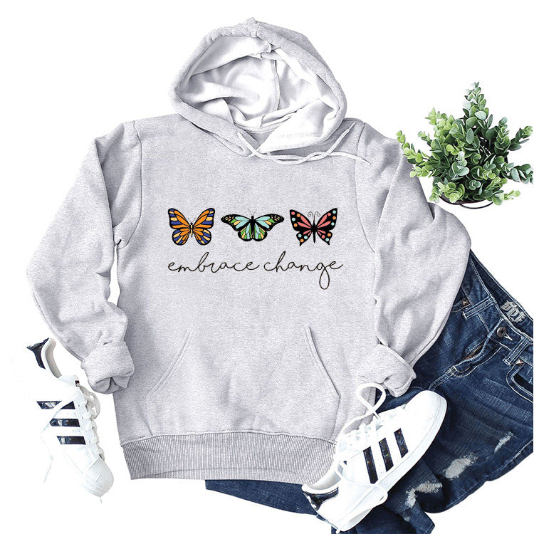 Dame hoodie med inspirerende sommerfuglemotiv og motiverende budskab Stilla