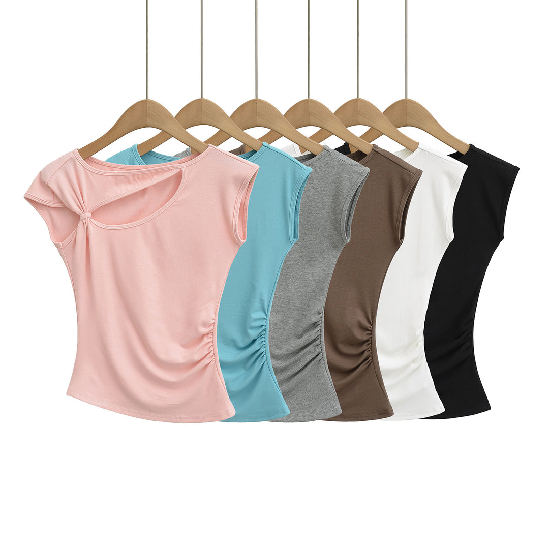 Dame sportslig top med asymmetrisk snit og modige cut-out-detaljer Stilla