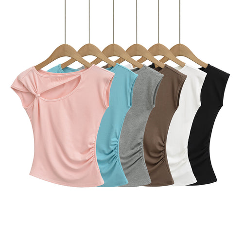 Dame sportslig top med asymmetrisk snit og modige cut-out-detaljer Stilla