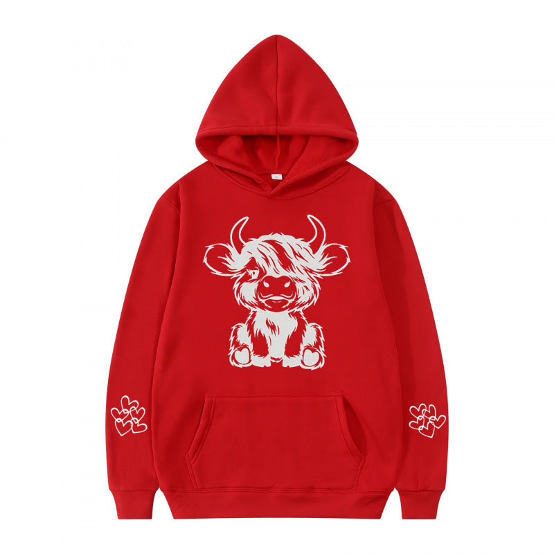 Kvindernes hætte sweatshirt med charmerende kvægmotiv og praktiske kængurulommer Skovae