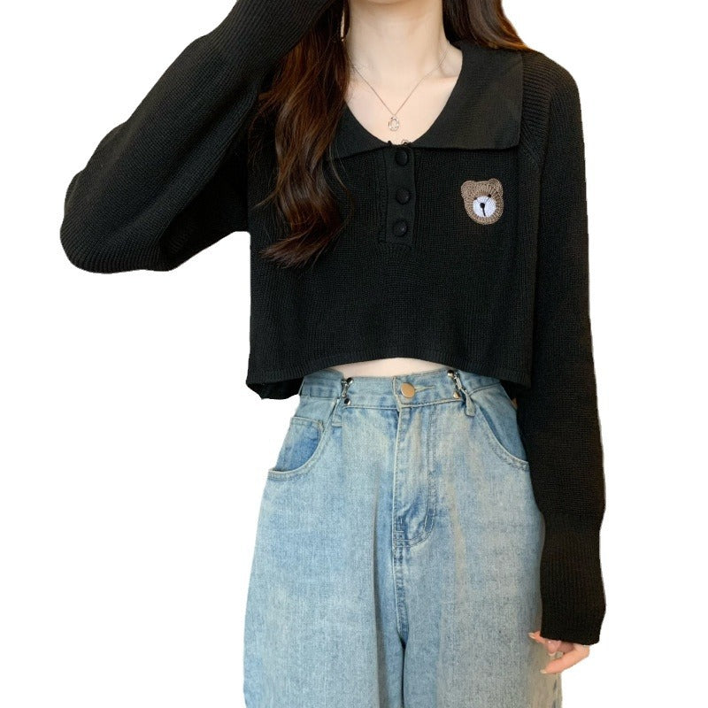 Kvinder Cropped Pullover med en knaplukning og unicorn emblem