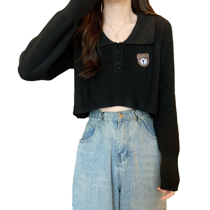 Kvinder Cropped Pullover med en knaplukning og unicorn emblem