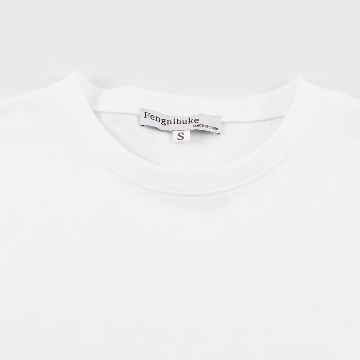 Dame T-shirt med elegant spids-snit og tidløs sløjfe-applikation Skovae