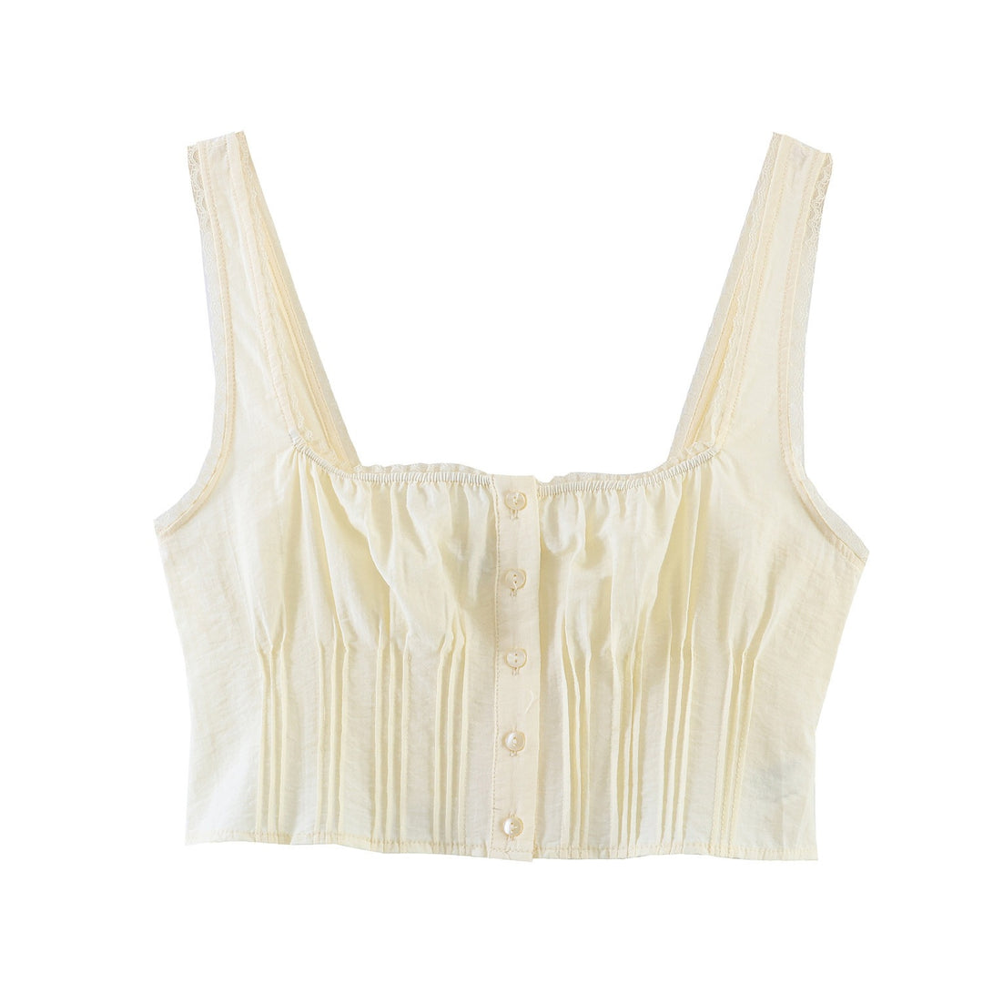 Dame-crop-top med fine folder og dekorknapper Skovae