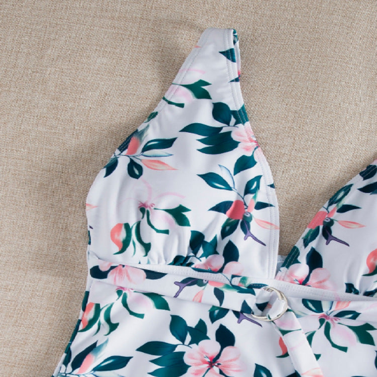 Dame én-delt badedragt med elegant snøre detaljer og floralt design Stilla
