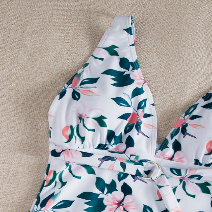 Dame én-delt badedragt med elegant snøre detaljer og floralt design Stilla