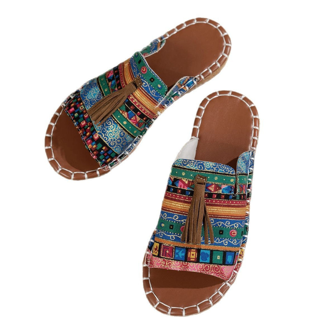 Dame slide-sandaler med farverigt vævdesign og fashionable kvaster Stilla