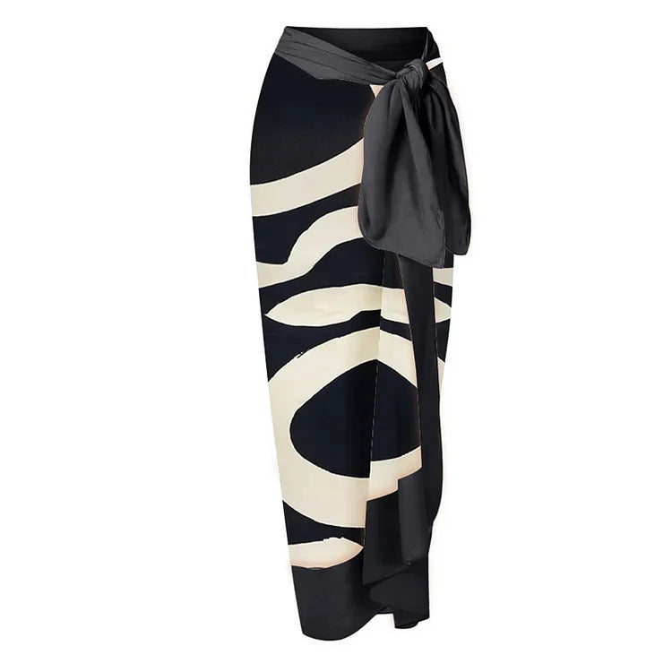 Dame bikiniset med asymmetrisk top og elegant omslagsskjørt Skovae