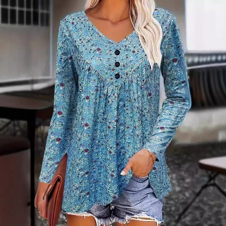 Damebluse med blomsterdesign og knapdetaljer Stilla