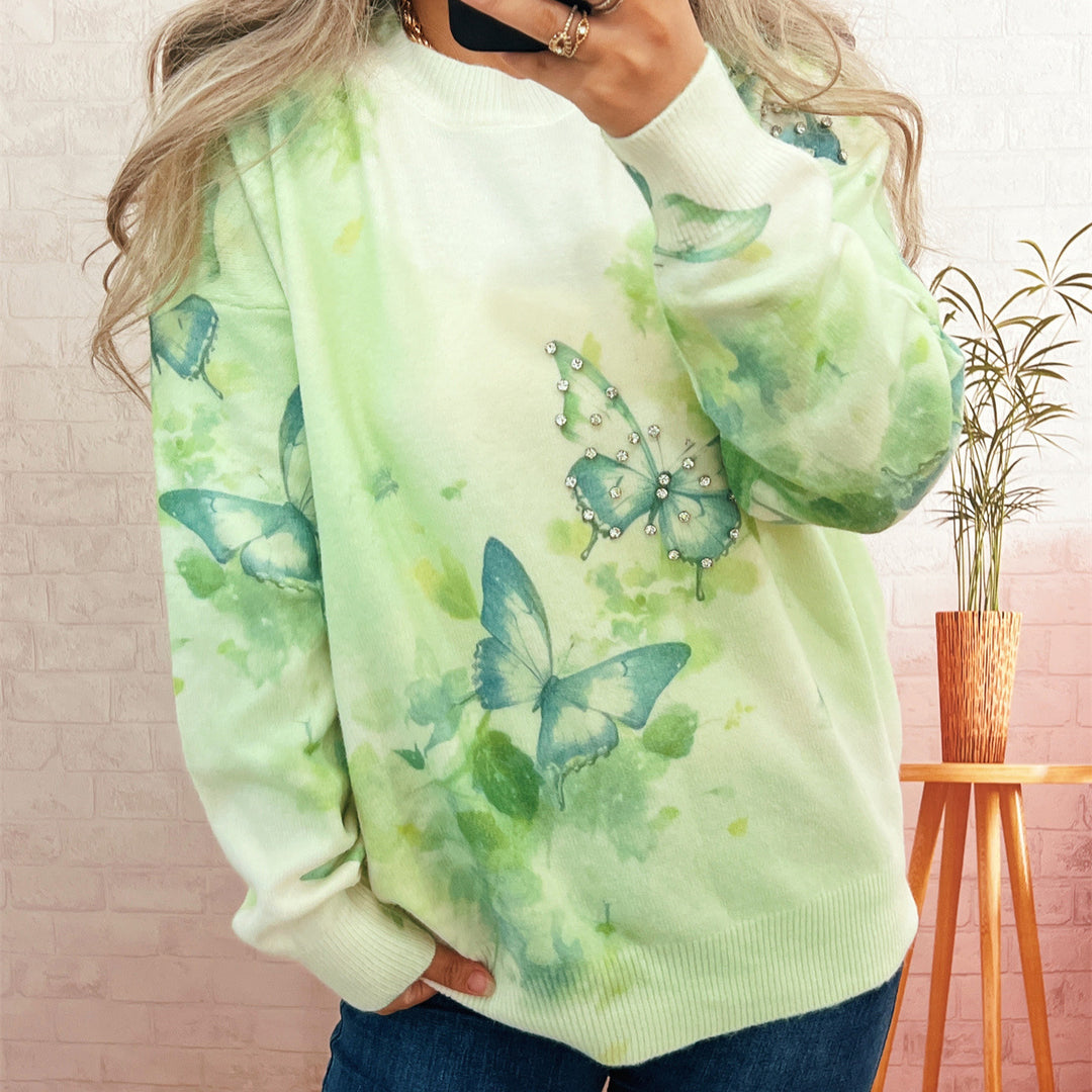 Damer strikket pullover med glitrende sommerfugleapplikationer Stilla