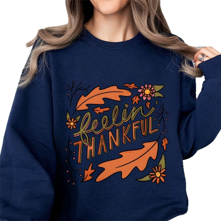 Kvinders sweatshirt med farverigt efterårsdesign og inspirerende tekst Stilla