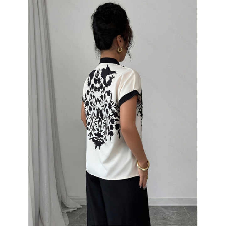Damebluse med florale detaljer og elegant skæring Skovae