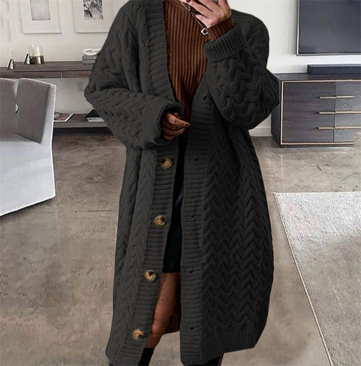 Kvindernes strik cardigan med voluminøst kabeldesign og praktiske knaplukninger Stilla