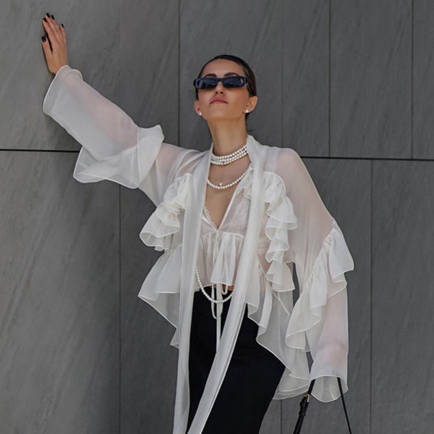 Dame Transparent Rynkebluse med voluminøse ærmer og elegant design Stilla