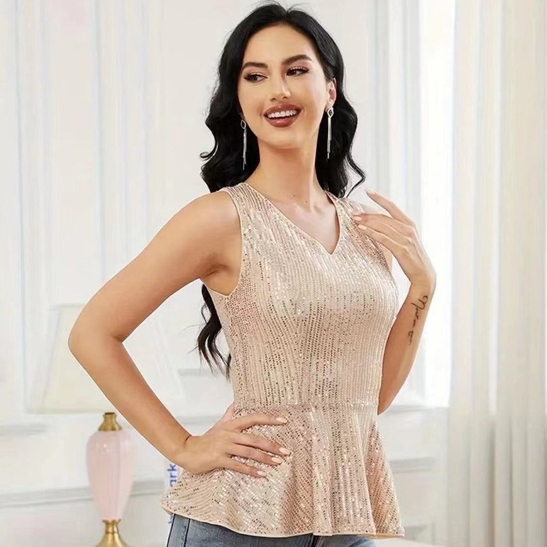 Dame Peplum top med skinnende pailletdetaljer og elegant snit Stilla