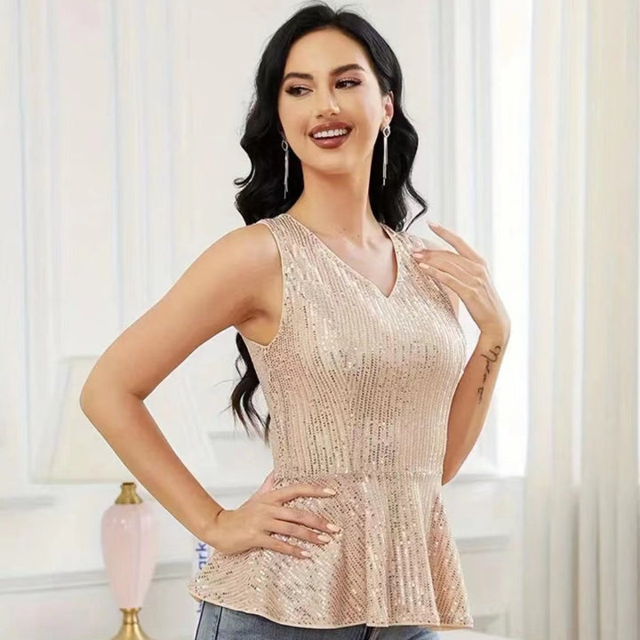 Dame Peplum top med skinnende pailletdetaljer og elegant snit Stilla