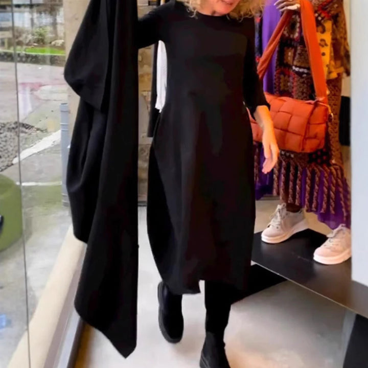 Dame asymmetrisk kjole med praktiske lommer og elegant design Stilla