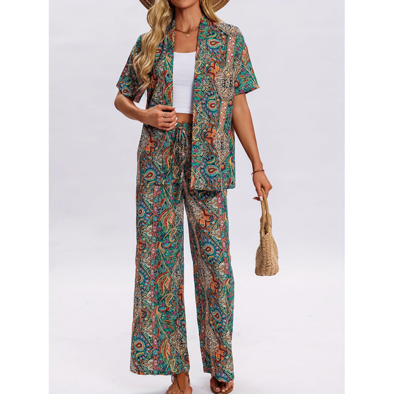 Dame kortærmet jumpsuit med flæse detaljer og bindebælte Skovae