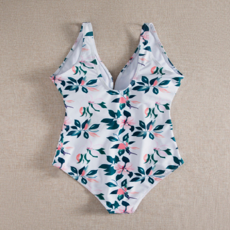 Dame én-delt badedragt med elegant snøre detaljer og floralt design Stilla